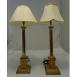 A pair of brass Corinthian column table lamps on stepped square bases, to include shades, 82cm (h)