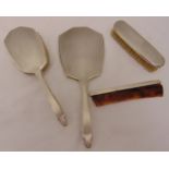 An engine turned hallmarked silver four piece dressing table set to include a hand mirror, a hair