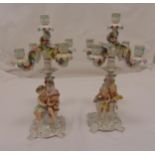 A pair of Sitzendorf five light candelabra the figural stems representing the four seasons and