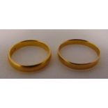 Two 22ct yellow gold wedding bands, approx total weight 5.8g