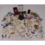 A quantity of costume jewellery to include necklaces, brooches, rings, bracelets and earrings