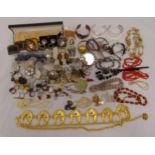 A quantity of costume jewellery to include necklaces, brooches, bangles, rings, pendants and