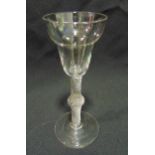 A 19th century toasting glass with spirally fluted twist stem on raised circular base, 16cm (h)