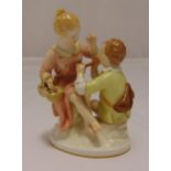 KPM Berlin figural group of a boy and girl, on raised oval base, sceptre and orb marks to the