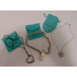 A quantity of Tiffany and Co silver jewellery to include a pendant necklace, a large link fob