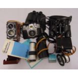 A quantity of optical equipment to include a Zeiss Ikon Contarex camera, lenses and binoculars (6)