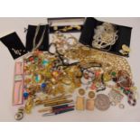 A quantity of costume jewellery to include rings, necklaces, earrings and brooches