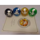 A set of four Baccarat cameos crystal paperweights of the Royal Family to include the Queen,