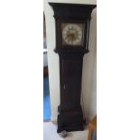 An oak long cased clock with silvered dial and Roman numerals by Josiah Whittman of Chichester, to