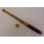 An early 20th century miniature three draw brass telescope