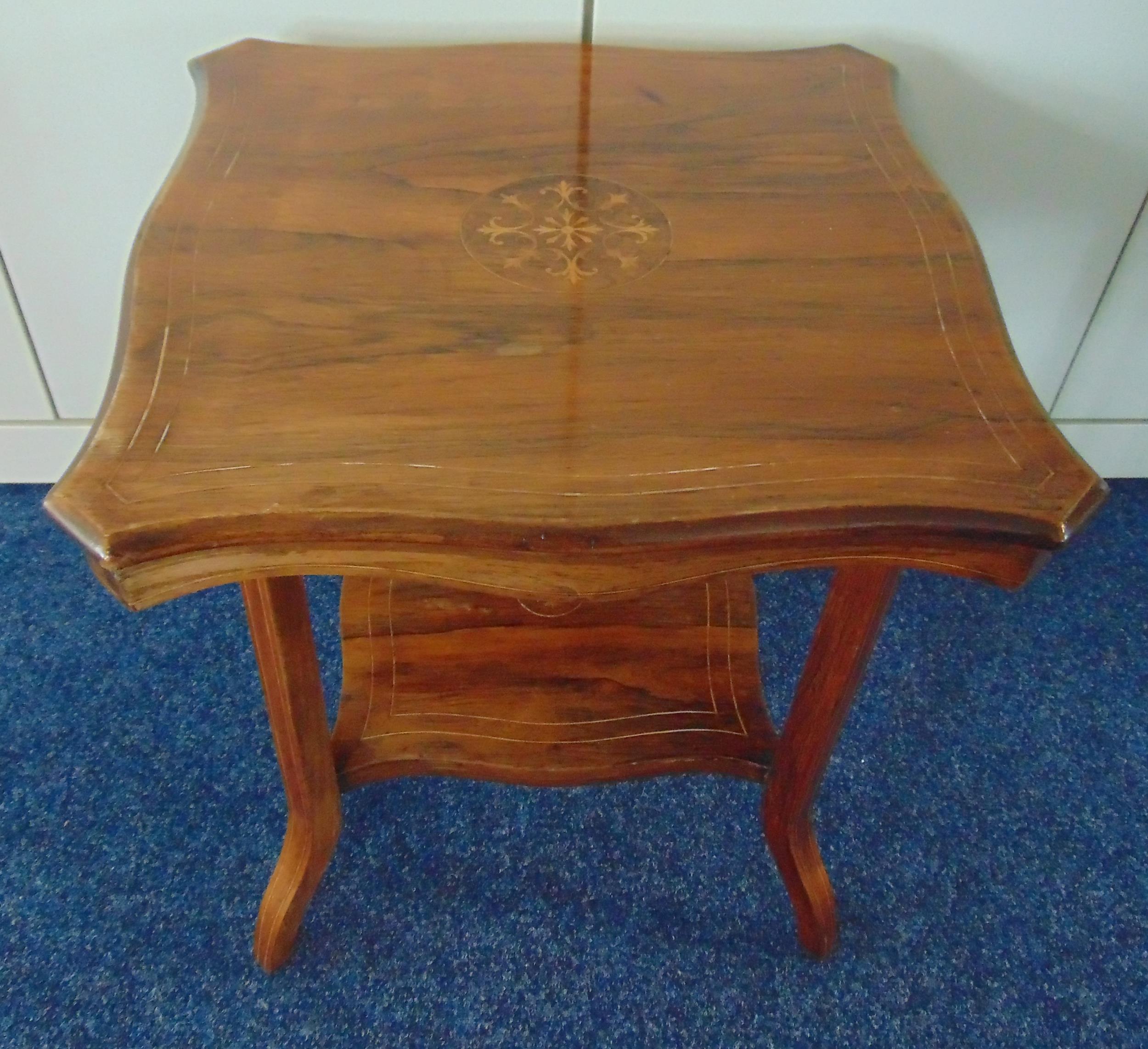 An Edwardian mahogany square side table with satinwood inlays on four angled rectangular legs, 52