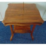 An Edwardian mahogany square side table with satinwood inlays on four angled rectangular legs, 52