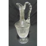 Saint Louis crystal glass ewer of classical form on raised star cut circular base, 21cm (h)