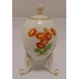 Meissen egg shaped urn and cover, decorated with flowers on three scroll legs, marks to the base,