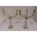 A pair of hallmarked silver three light candelabra, knopped fluted baluster stems on raised square