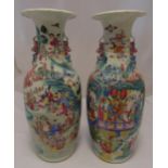 A pair of early 20th century Chinese baluster shaped vases decorated with figures, flowers and