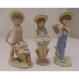 Three Lladro figurines of girls with flowers, marks to the bases, tallest 24cm (h)