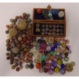 A quantity of antique marble and early 20th century glass marbles