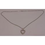 18ct white gold and diamond heart shaped pendant on an 18ct gold chain, approx total weight 8.2g