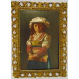 A continental framed oil on panel of a young girl wearing traditional dress and holding an apple, 46