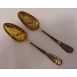 A pair of George II hallmarked silver berry spoon, later chased, London 1759