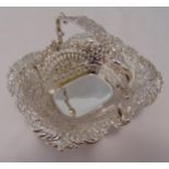 A Victorian hallmarked silver bonbon basket, rounded rectangular, pierced and chased with flowers,