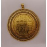 21ct gold Israeli coin set in an 18ct gold filigree frame, approx total weight 33.8g