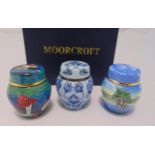 Three Moorcroft miniature enamel boxes and covers decorated with flowers, mushrooms and