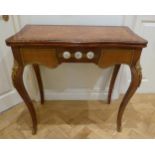 A French style inlaid rectangular games table with applied porcelain roundels and gilded metal