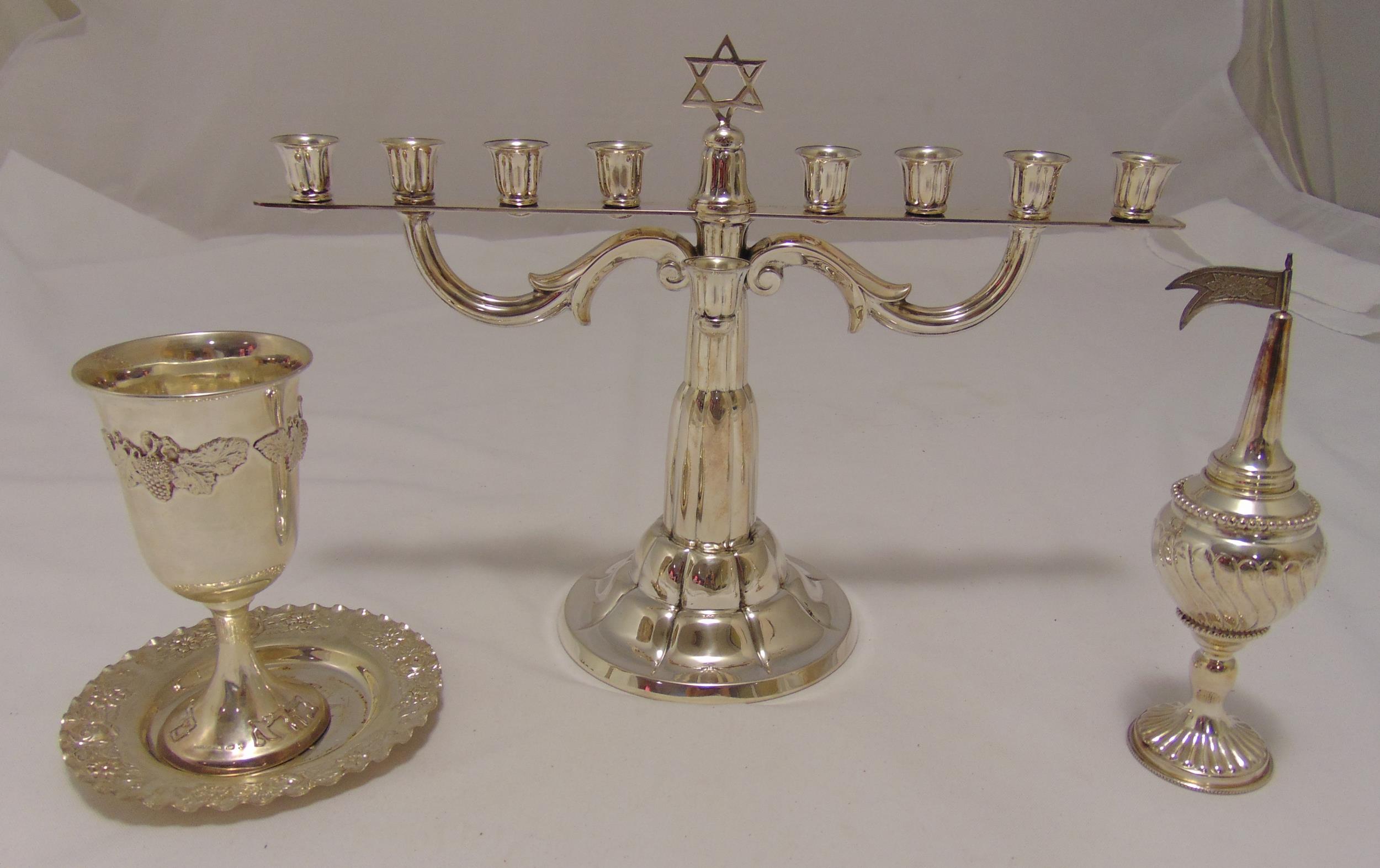 A quantity of Israeli white metal to include Kiddush cup and stand, a spice box and a Menorah,