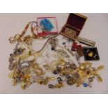 A quantity of costume jewellery to include necklaces, earrings and bangles