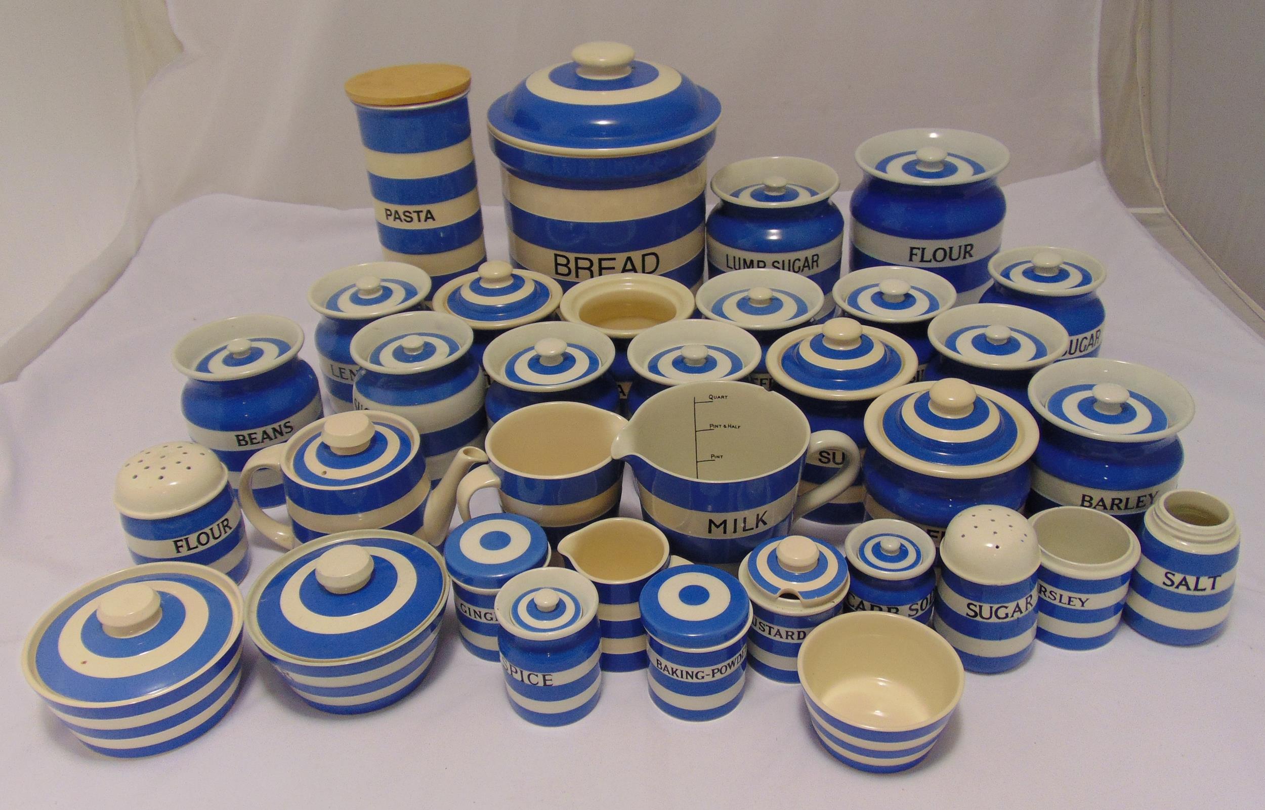 T.G. Green blue and white kitchen containers to include jars with covers, a teapot, jugs, a flour