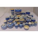 T.G. Green blue and white kitchen containers to include jars with covers, a teapot, jugs, a flour