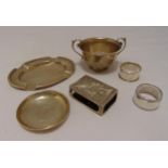 A quantity of hallmarked silver to include a two handled dish, coasters, two napkin rings and a