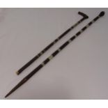 Two Afghan hardwood walking canes inlaid with mother of pearl, longest 123cm