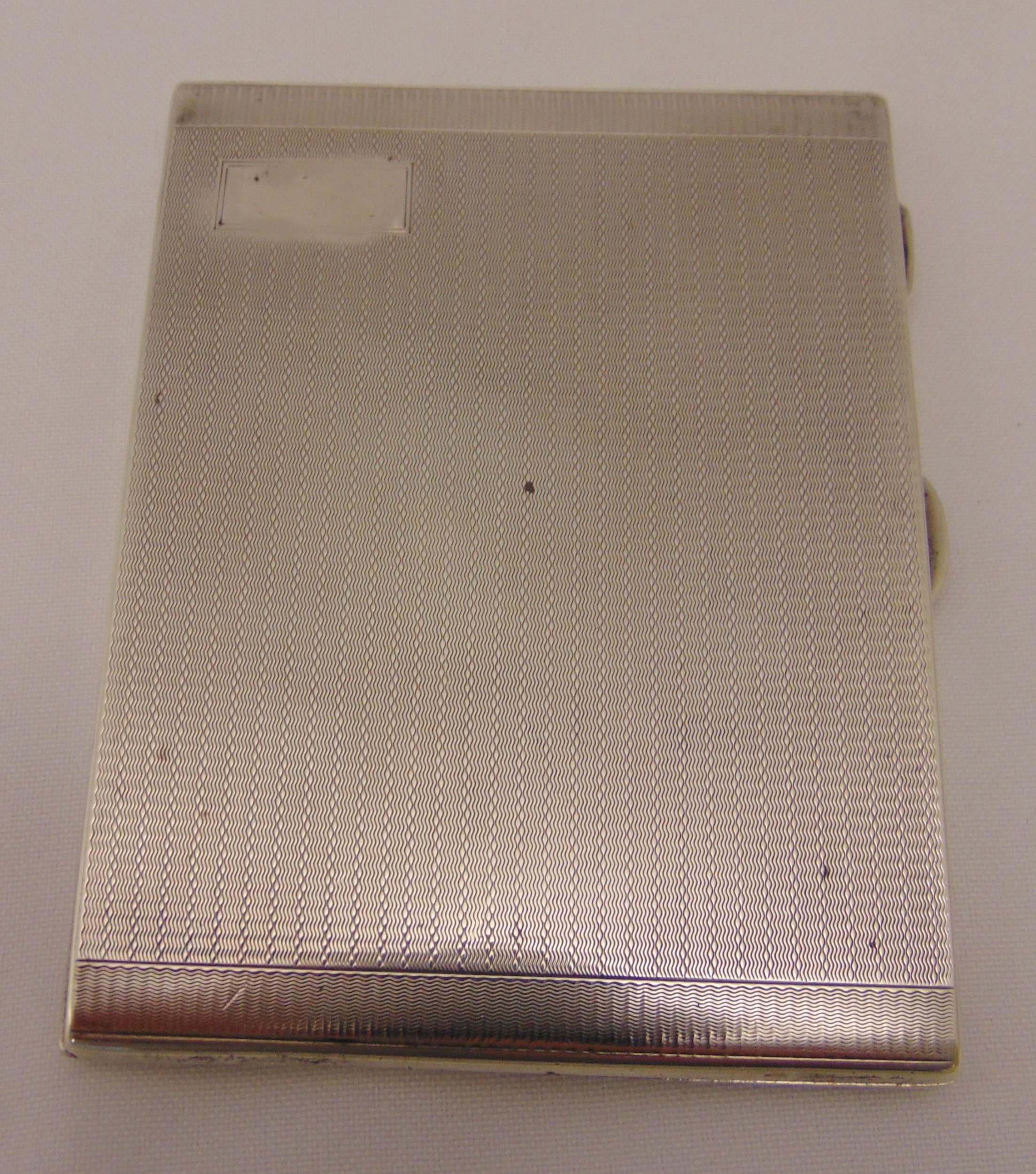 A hallmarked silver engine turned cigarette case, approx total weight 170g