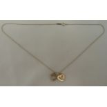 Tiffany and Co 18ct gold and silver pendant and chain