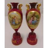 A pair of Vienna red ground baluster vases with images of courting couples and gilded decoration