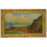 A framed Victorian oil on canvas of fishermen on the beach by their boats, indistinctly signed