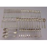 A hallmarked silver mixed antique quantity of fiddle pattern flatware to include twelve dessert