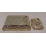A continental silver jewellery casket, rectangular the sides and hinged cover chased with putti,