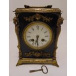 A gilded metal and ebonised mantle clock with white enamel dial and Roman numerals, 22cm (h)