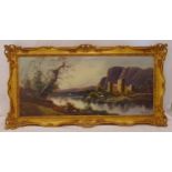 A framed oil on canvas landscape with a lake and a castle in the background, indistinctly signed