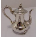 A Victorian hallmarked silver coffee pot, fluted pear shape engraved and chased with leaves and