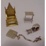 A quantity of novelty miniature silver and white metal pieces to include a stamp case in the form of