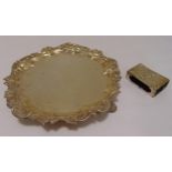 A Victorian hallmarked silver salver with leaf and scroll border on three pierced shell feet,