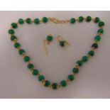 Malachite and gold necklace and a pair of matching earrings