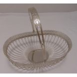A continental white metal roll basket, oval wirework sides with scroll pierced border and swing