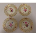 Four Meissen cabinet plates, circular with lattice pierced sides, decorated to the centre with