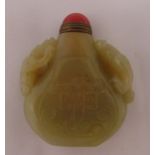A Celadon jade snuff bottle, pear shaped with carved figures to the sides, 6cm (h)